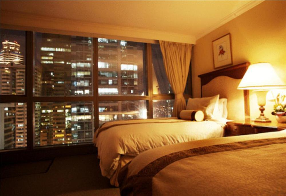 Discovery Suites Manila, Philippines Pásig Habitación foto